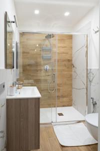 a bathroom with a shower and a toilet and a sink at La dolce vita rooms in Rome