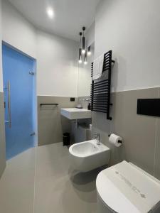 Ванна кімната в OMÍ Aparthotel
