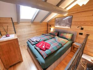 a small room with a bed in a cabin at Ak House in Aprica