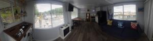 a living room with two windows and a couch at Long Cove Resort and Marina in Charlotte