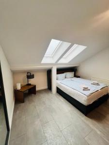 a bedroom with a bed and a skylight at Domizil in Bremen