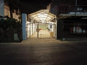 a gate with a basketball hoop inside of a building at Bungalow at Porvorim, Panaji in Panaji