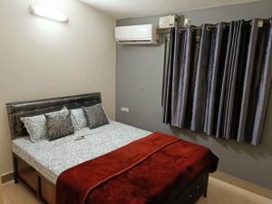 a bedroom with a bed and a radiator at Bungalow at Porvorim, Panaji in Panaji