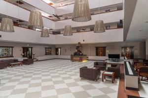 a large room with a person standing on a podium at Vila Galé Fortaleza in Fortaleza +71 photos