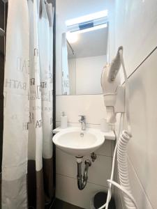 a bathroom with a sink and a mirror at Domizil in Bremen