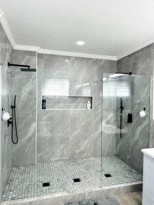 a shower with a glass door in a bathroom at Ridge View in Kingstown