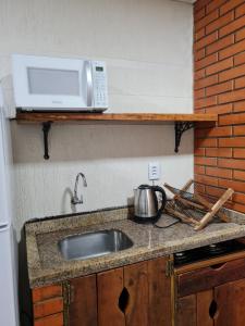 Küche/Küchenzeile in der Unterkunft Kitnet em Torres