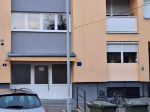 a car parked in front of a building at Apartman Arija - Self Check In in Osijek