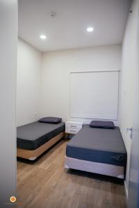 Una cama o camas en una habitación de Cookandmusicapartments Forvm Molas López