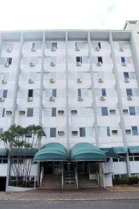 a large white building with a lot of windows at Days inn by Wyndham Uberlândia in Uberlândia +42 photos
