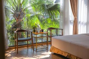 Ein Bett oder Betten in einem Zimmer der Unterkunft Tam Coc Serenity Hotel & Bungalow