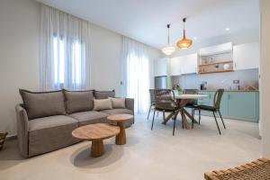 a living room with a couch and a table at Kondias Experience in Kondiás