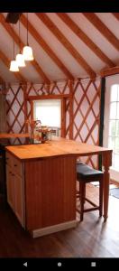 een keuken met een houten eiland in een kamer bij Madison's ONLY yurt experience! in Vevay