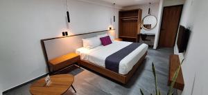 Postel nebo postele na pokoji v ubytování QUINTA SAN CLEMENTE