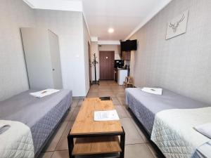 Postel nebo postele na pokoji v ubytování Orange Tree Hotel