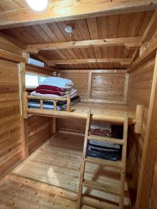 a sauna with two bunk beds in a log cabin at Nasu Takahara Auto Campsite - Vacation STAY 42066v in Nasushiobara