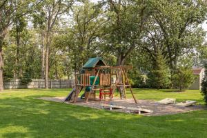 a playground in a park with a play structure at Bay Colony 761 - Lower in Nisswa