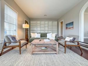 a living room with a couch and a coffee table at New Comfy Bungalow on Washington-Dedicated Office in Waco