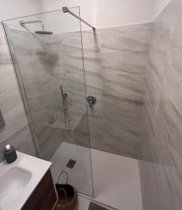 a shower with a glass door in a bathroom at Studio cosy de charme ! in Beaulieu-sur-Mer