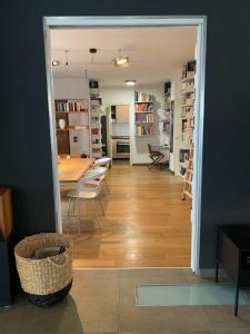 a dining room and living room with a table and chairs at Casa Paslawski in Corciano