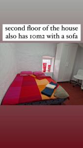 Giường trong phòng chung tại Alora Sweet Home