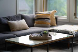 a living room with a couch and a coffee table at Tremblant Prestige - Les Eaux 227-3 in Mont-Tremblant