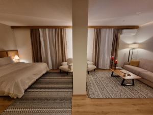 Postel nebo postele na pokoji v ubytování Likoria Hotel