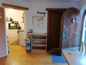 a room with a desk and a wooden door at Apartment Martina in Telfs