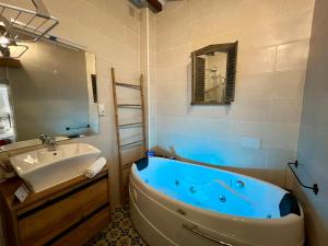 a bathroom with a blue tub and a sink at Hotel Altea Paradise 1917 - Adults Only in Altea