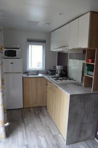 Kuchyň nebo kuchyňský kout v ubytování Riva Bella chez Caraphou