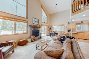 a living room with a couch and a fireplace at Fairway View in McCall