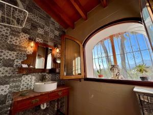 a bathroom with a sink and a large window at Hotel Altea Paradise 1917 - Adults Only in Altea