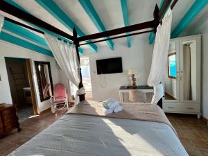 a bedroom with a bed with a blue ceiling at Hotel Altea Paradise 1917 - Adults Only in Altea