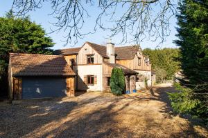 an image of a house with a garage at Cheerful 7-bedroom house with hot tub sleeps 24 in Iron Acton