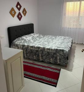 a bedroom with a bed in a room at Asli's Comfy Studio APT in Tirana