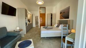 a bedroom with a bed and a living room at Apartments Villa Agatha in Sveti Filip i Jakov