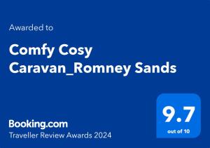 a blue sign with the words campus cozy caravanonymonym swaps at Comfy Cosy Caravan_Romney Sands in Littlestone-on-Sea
