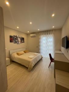Letto o letti in una camera di Ro&Ro Napoli luxury rooms