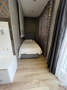 Postel nebo postele na pokoji v ubytování Dolce Vita Suite Hotel