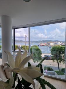 a large window with a view of the water at Apartamentos Puerto Camariñas in Camariñas