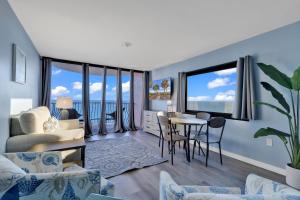 a living room with a view of the ocean at 15-th Floor Ocean Front Views at Palms Resort in Myrtle Beach +33 photos