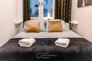 Posteľ alebo postele v izbe v ubytovaní Happy Day - ApartamentyHappy pl