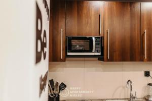 Kuchyňa alebo kuchynka v ubytovaní Happy Day - ApartamentyHappy pl