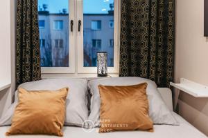 Posteľ alebo postele v izbe v ubytovaní Happy Day - ApartamentyHappy pl