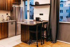 Kuchyňa alebo kuchynka v ubytovaní Happy Day - ApartamentyHappy pl