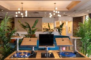 a room with a table with a laptop on it at Hotel Burbank in Burbank