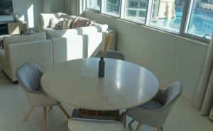 a dining room with a table and chairs at Downtown Oasis, Burj Khalifa Views, Luxury Amenities in Dubai