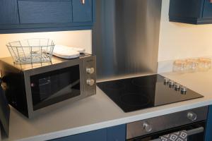 Köök või kööginurk majutusasutuses The Links Suites