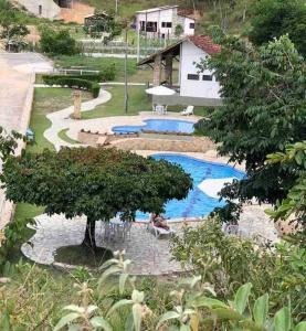 an overhead view of a swimming pool with a tree at Casa dos Colibris, Lugar memorável! in Chã Grande