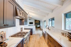 a kitchen with white counters and a stove top oven at 6 Mi to Slopes Mtn-View Retreat in Lake Tahoe in South Lake Tahoe